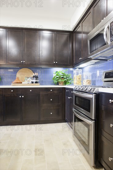 Kitchen with brown cabinets at home