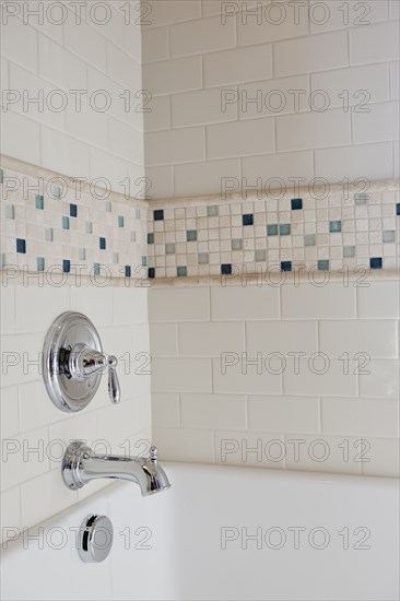 Close-up of shower taps in bathroom at home