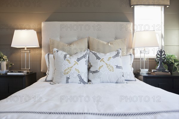 Pillows arrange on bed in contemporary bedroom