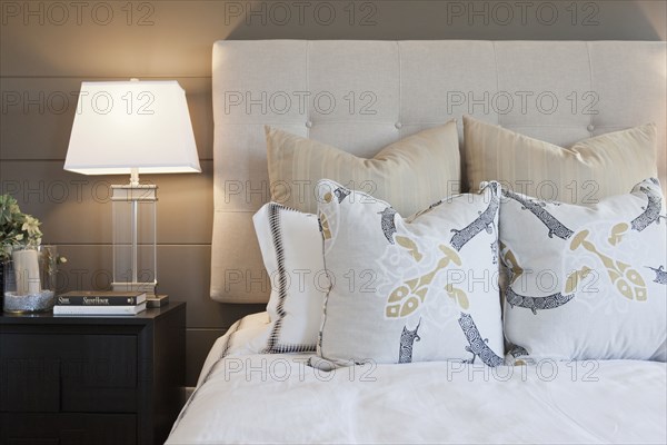 Pillows arrange on bed in contemporary bedroom