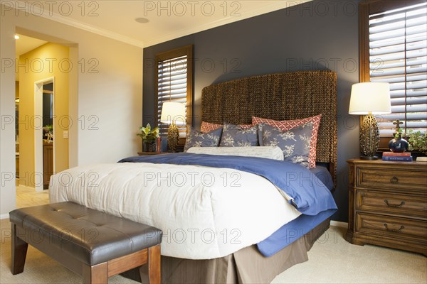 Interior of tidy bedroom of middle class house