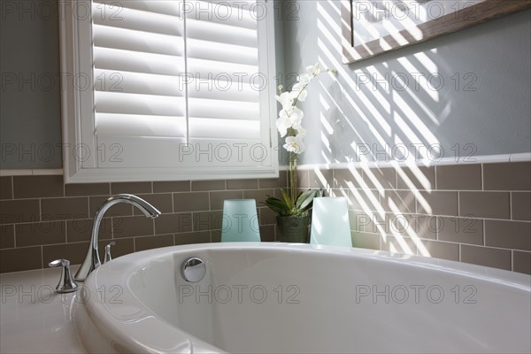 Faucet at bathtub in bathroom