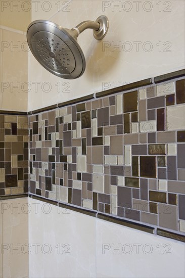 Shower in tiled bathroom