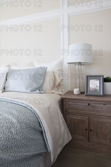 Night table by bed in middle class house