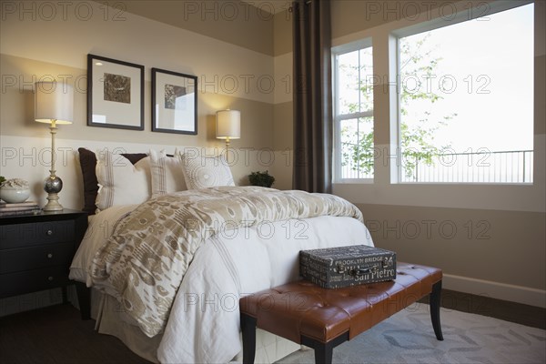 Bed and foot stool in middle class house