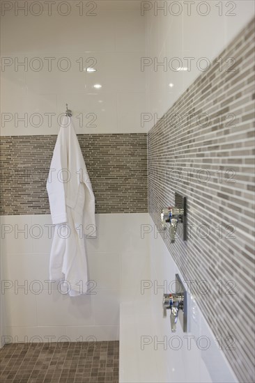 Bathrobe hanging in domestic bathroom