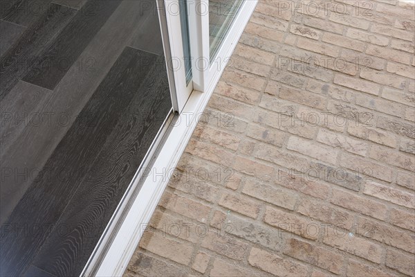 High angle view of stone flooring and sliding door at porch