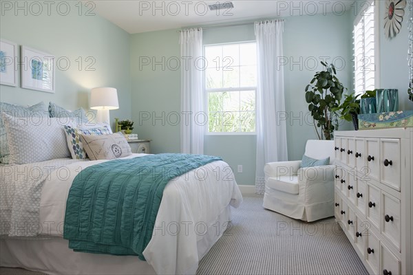 Bed and drawers in bedroom