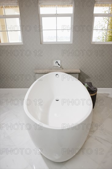 White free standing bathtub in contemporary bathroom