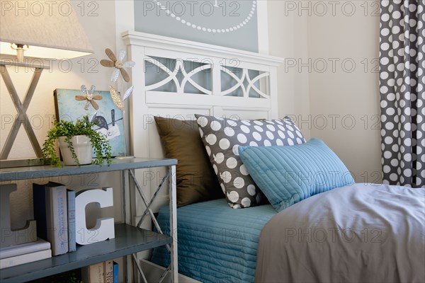 Bed and night table in middle class house