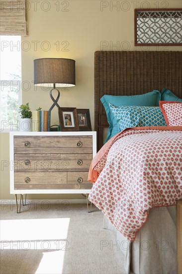 Wooden night table in bedroom