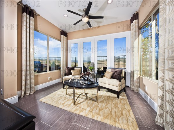 Living area in sunroom of house