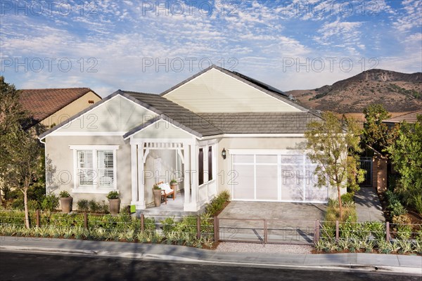 Exterior of a one story house with garage