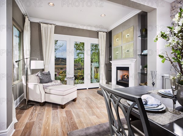 Sunroom with easy chair and footstool in house