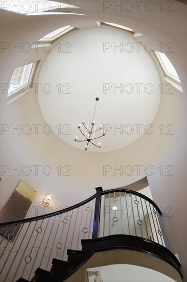 Low angle view of staircase and circular ceiling