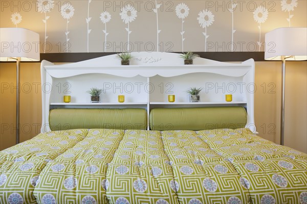 Interior of child's bed with floor lamps