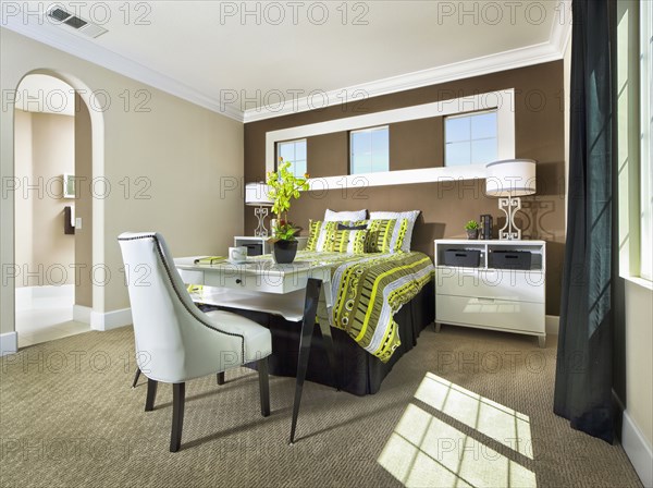 Interior of bedroom with brown accent wall