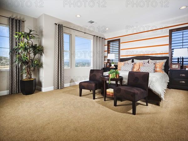 Interior of contemporary bedroom with seating furniture