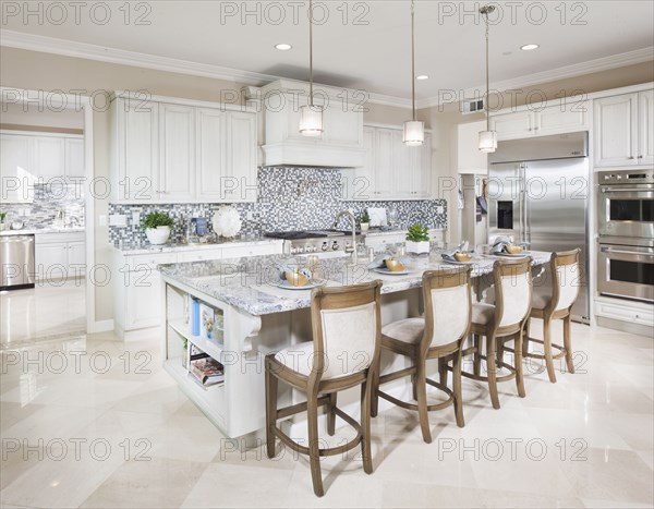 High stools at the kitchen island at home