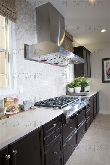 Kitchen having brown cabinets at home