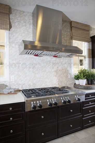 Kitchen having brown cabinets at home