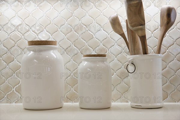 Close-up of jars on shelf at home