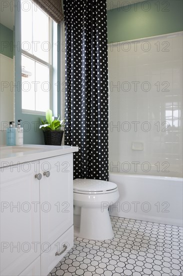 White cabinet with commode in the bathroom at home