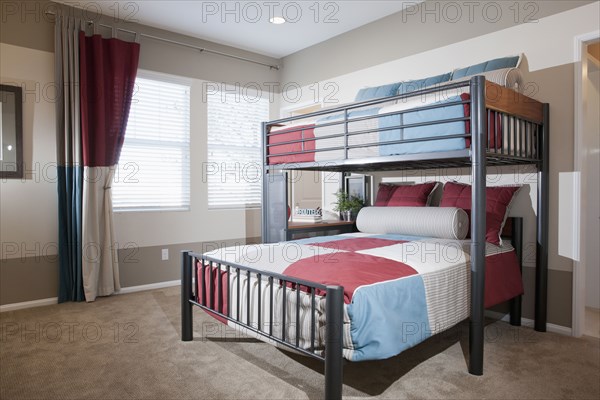 Bunk bed with carpeted floor at home