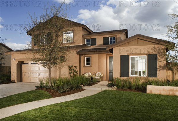 Walkway leading to front entrance of traditional home