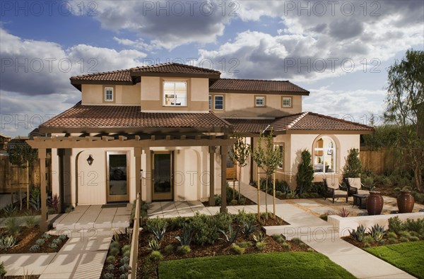 Walkway leading to front entrance of traditional home