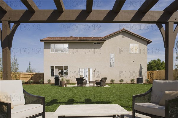 Patio and rear exterior of traditional home