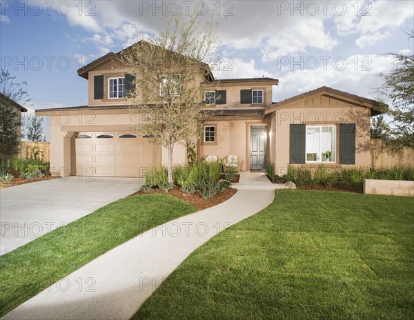 Side walk leading up to front entrance of traditional home