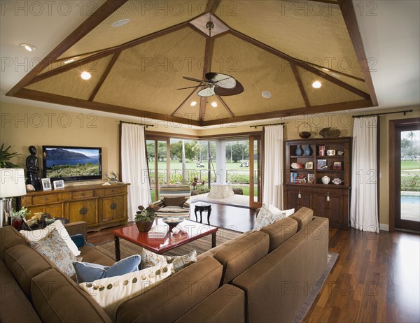 Living room with pocket doors open to patio