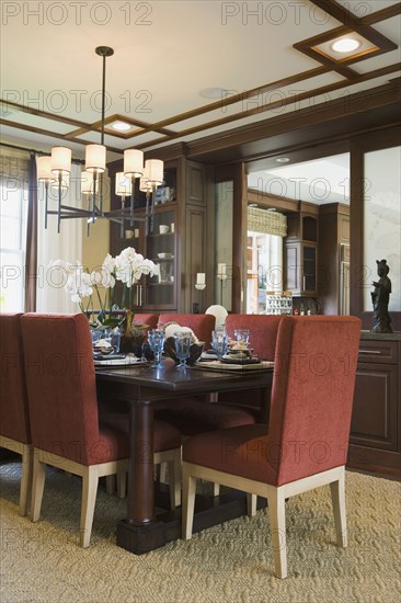 Contemporary dining table and red chairs