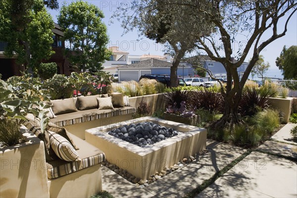 Outdoor sitting area with fire pit and sofa