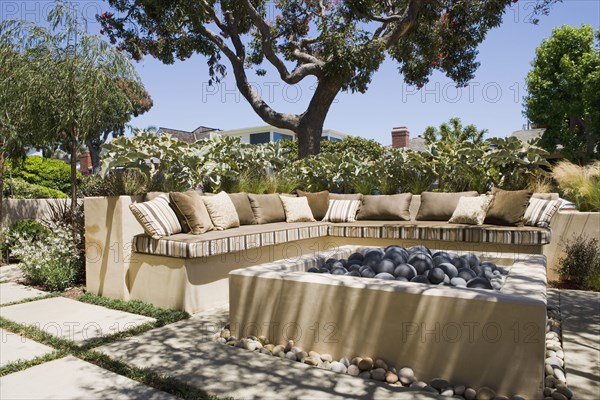 Outdoor sitting area with fire pit and sofa