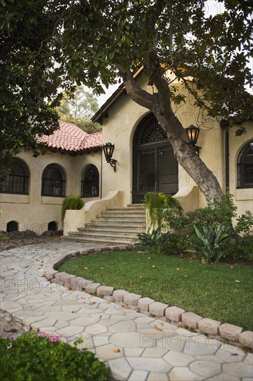 Pathway leading to entrance of old spanish home