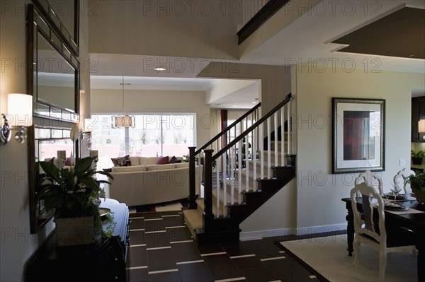 Landing at bottom of staircase in contemporary interior