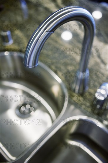 Gooseneck faucet above kitchen sink