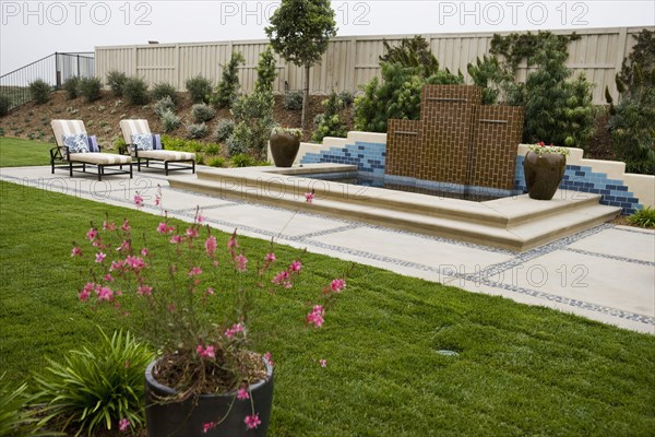 Back patio with contemporary fountain