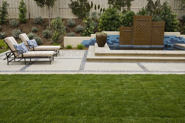 Back patio with contemporary fountain