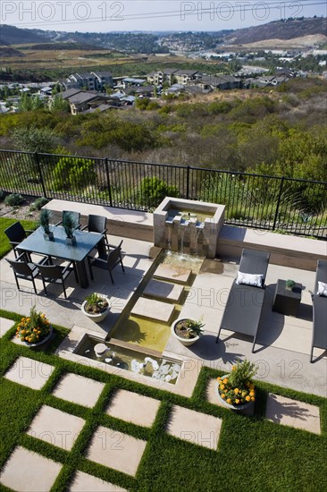 Back patio with contemporary fountain