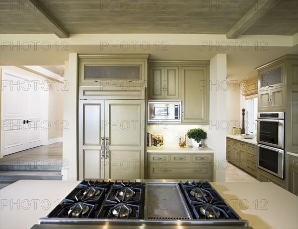 View over stove top of contemporary kitchen