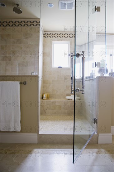 Open glass door to walk in shower