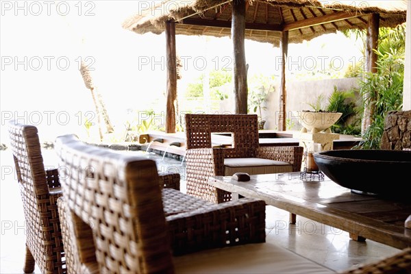 Tropical dining room with armchairs