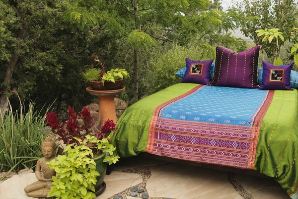 Colorful bedding on outdoor bed