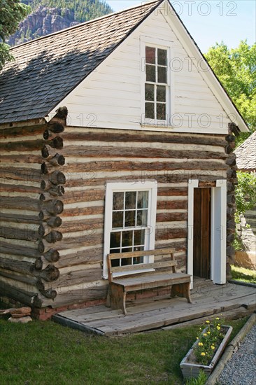 Bench outside log cabin