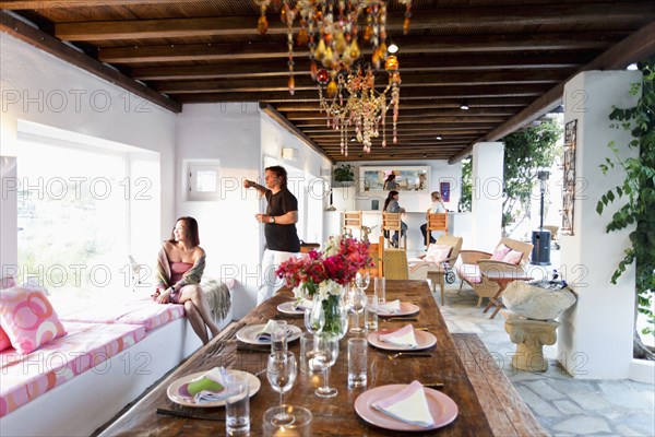 Place settings on wooden dining table