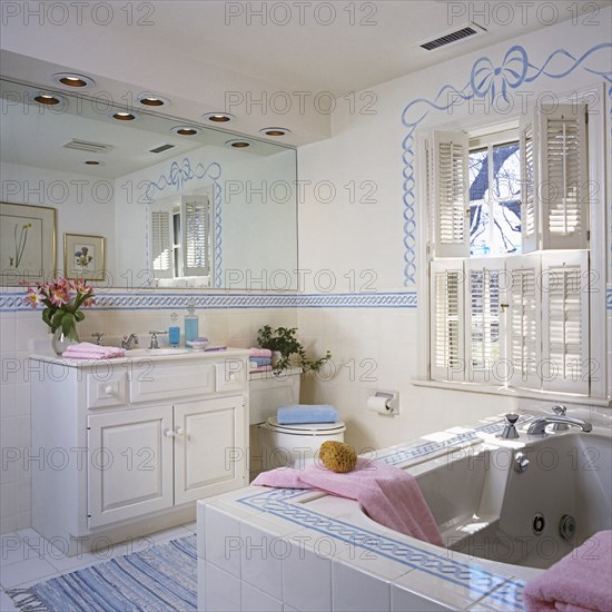 Stenciled bathroom from tub to vanity area