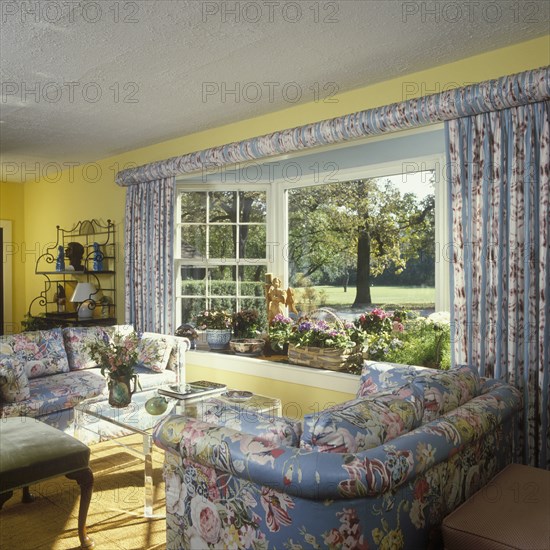 Traditional Living Room - floral chintz upholstered matching sofas and drapery